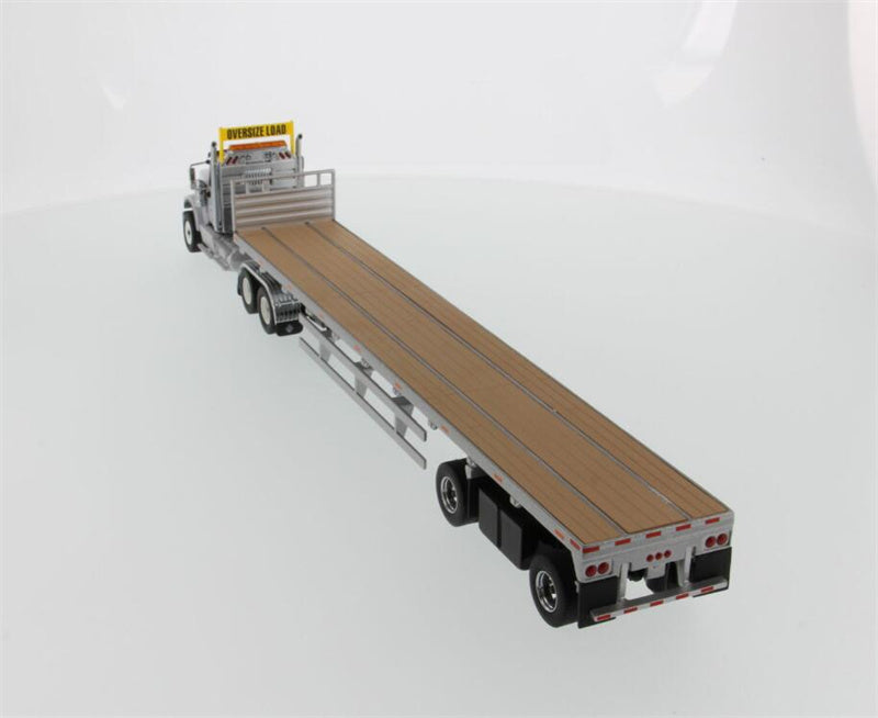 CATERPILLAR  International HX520 Tandem Tractor with 53′ Flat Bed Trailer – Light grey truck + Silver trailer 1:50 Truck Pre-built Model