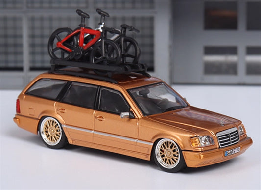 Mortal Mercedes Benz E-Class E300 station wagon S124 with 2 bicycles and luggage rack Gold - Gold Wheel low slung version Limited Edition 299PCS ONLY 1:64 Car Pre-built Model view1