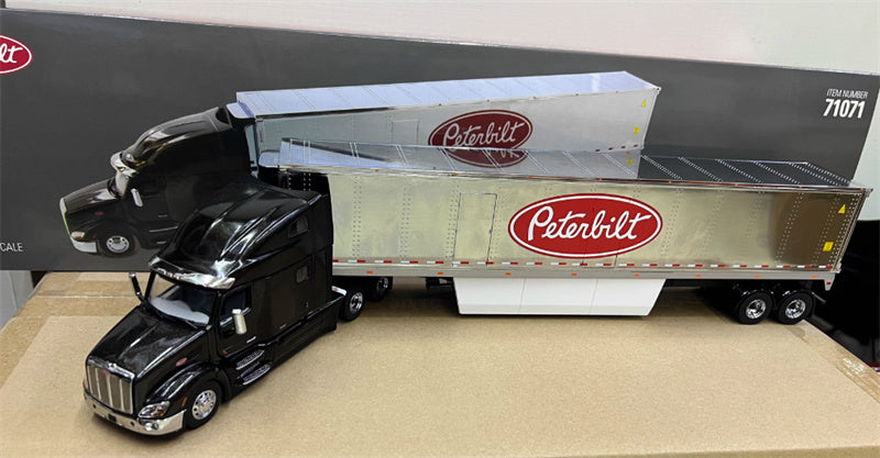 CATERPILLAR Peterbilt 579 UltraLoft Tractor with 53' refrigerated van – Legendary Black cab + 53' Chrome refrigerated van with Peterbilt logo 1:50 Truck Pre-built Model