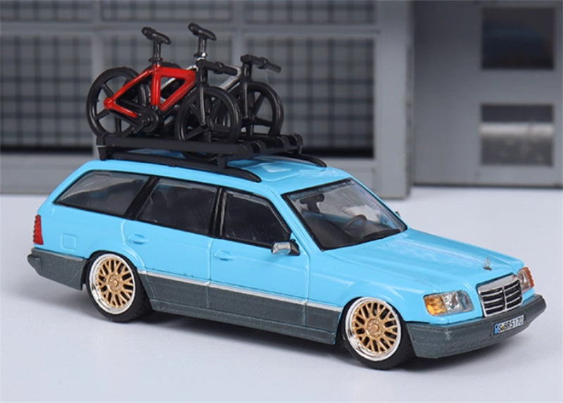 Mortal Mercedes Benz E-Class E300 station wagon S124 with 2 bicycles and luggage rack lake blue - Gold Wheel low slung version Limited Edition 299PCS ONLY 1:64 Car Pre-built Model view1