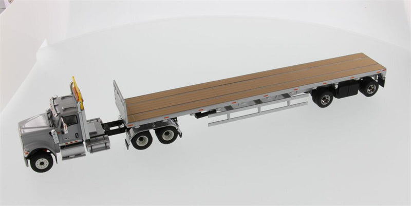CATERPILLAR  International HX520 Tandem Tractor with 53′ Flat Bed Trailer – Light grey truck + Silver trailer 1:50 Truck Pre-built Model