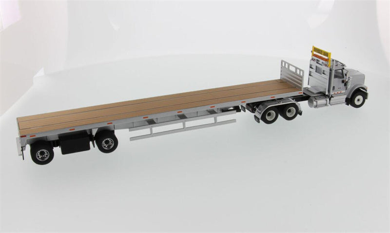 CATERPILLAR  International HX520 Tandem Tractor with 53′ Flat Bed Trailer – Light grey truck + Silver trailer 1:50 Truck Pre-built Model
