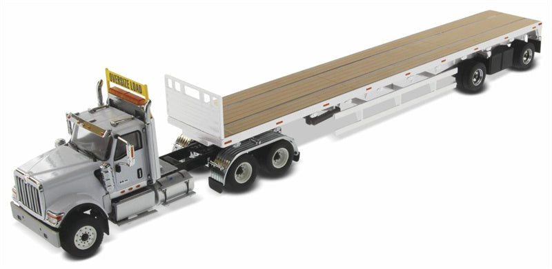 CATERPILLAR  International HX520 Tandem Tractor with 53′ Flat Bed Trailer – Light grey truck + Silver trailer 1:50 Truck Pre-built Model